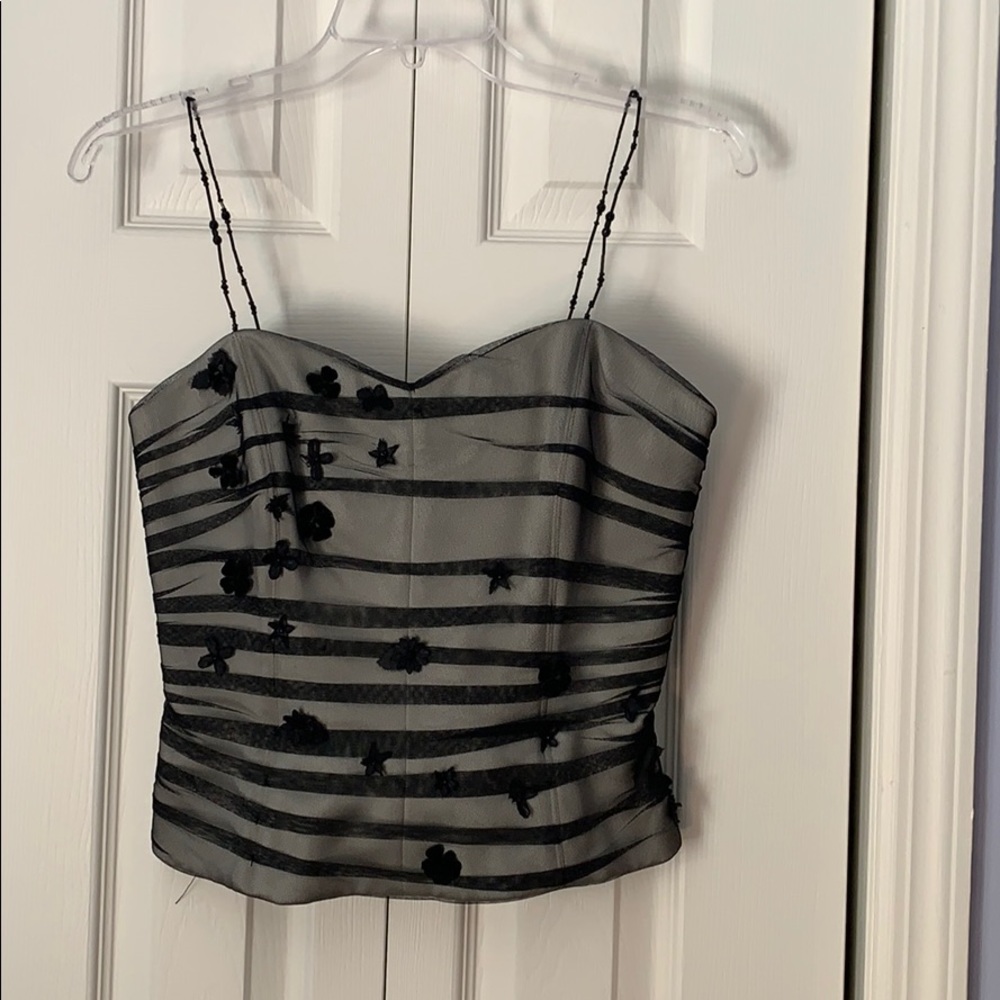 Dressy black top with flower  size 6